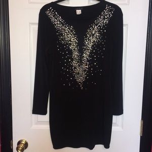 Short black dress with sequins.